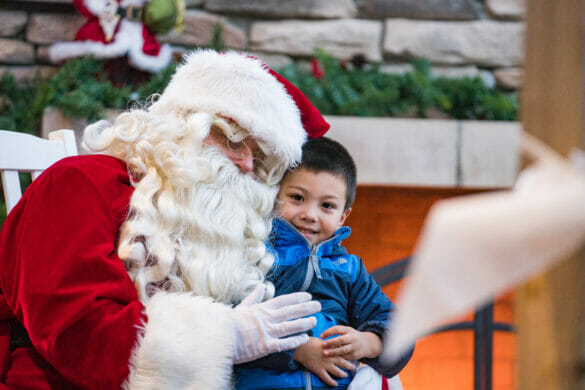 Child posing with Santa