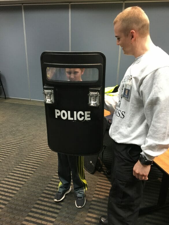 Little boy with police shield