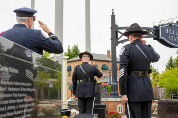 Officers saluting at memorial event