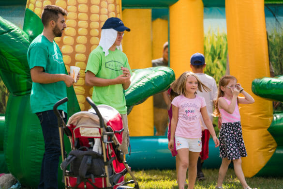 People in front of bouncy house