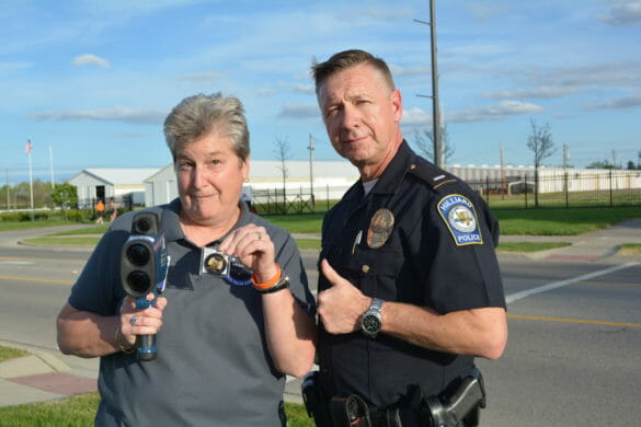 Woman posing with officer