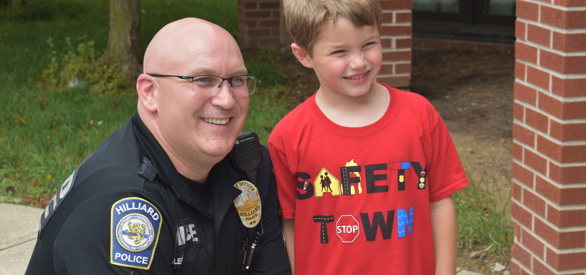 Boy and officer posing