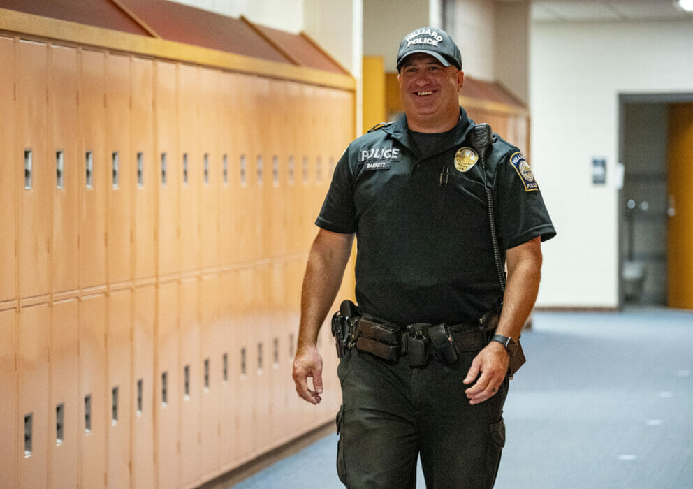 Officer walking through school