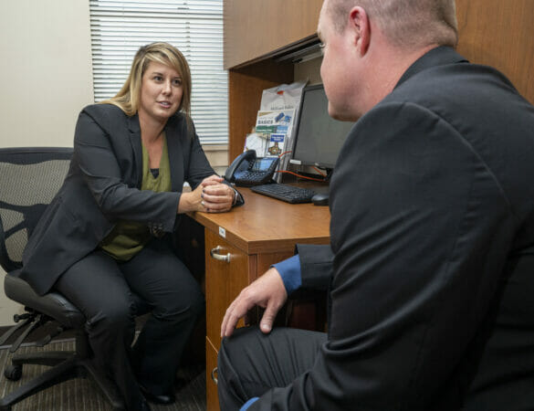 Two detectives talking in office