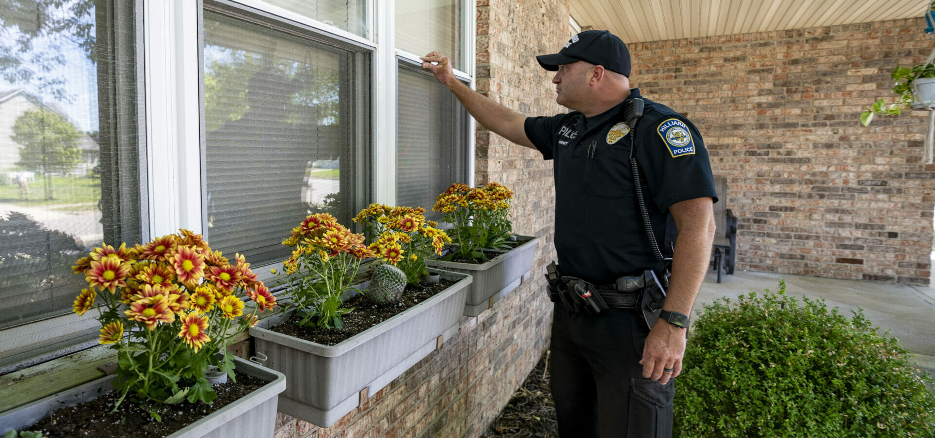 A police officers doing a vacation house check