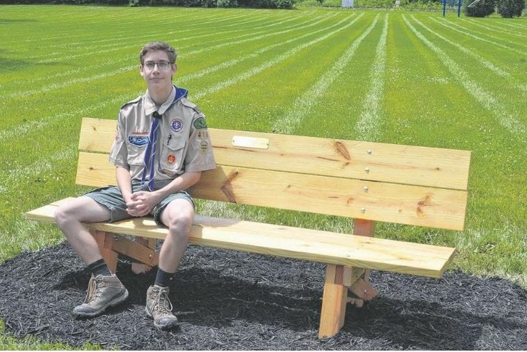 Eagle Scout sitting on bench