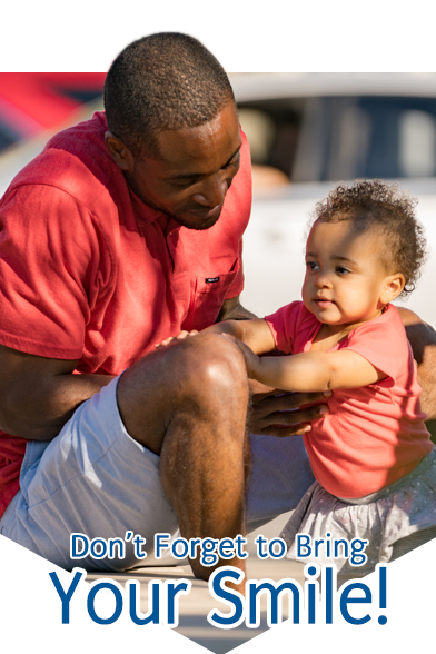 Man and daughter smiling
