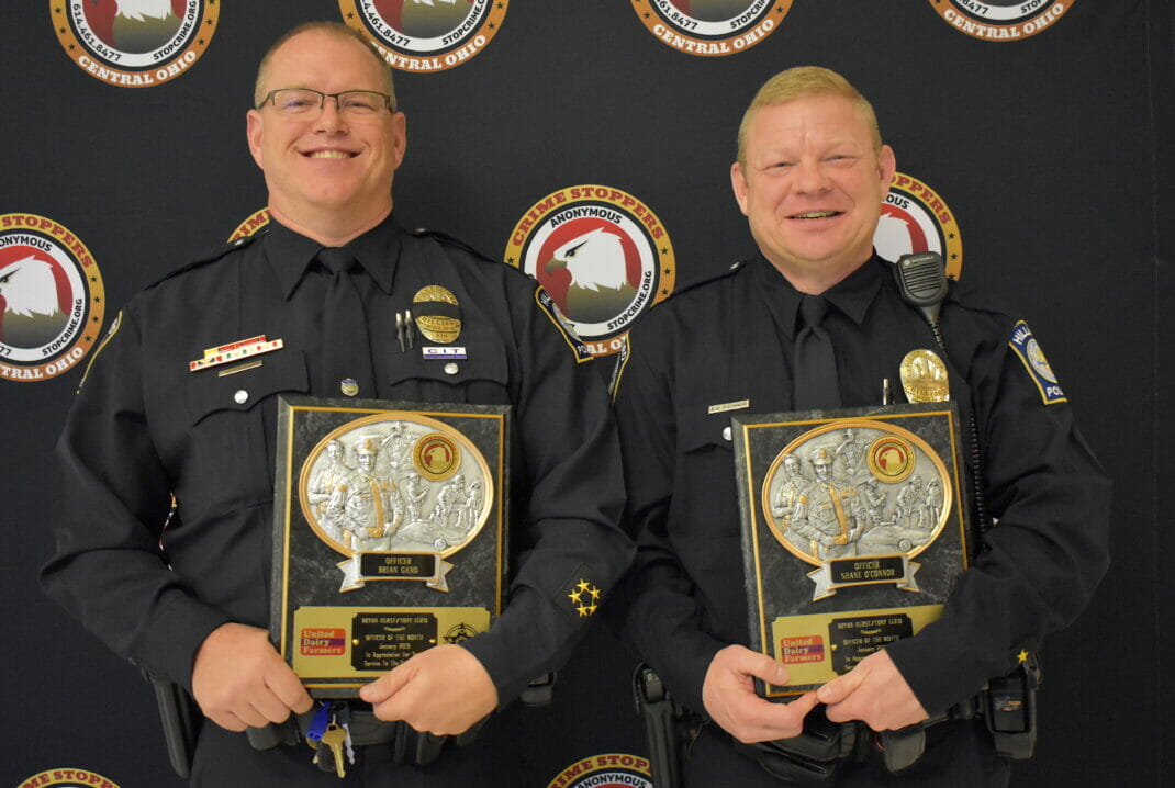 Officers Gano and O'Connor with awards