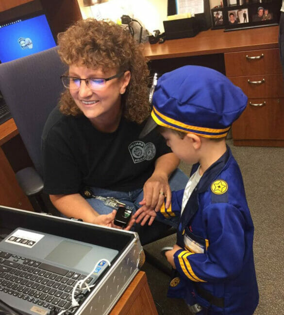 Officer Hyda helping a child do an EZ id