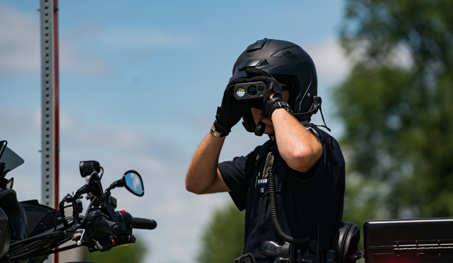 Officer looking through binoculars