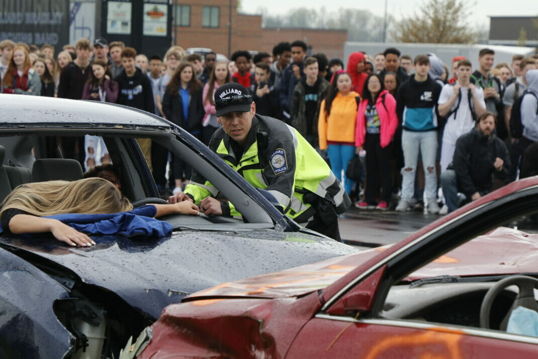 Officer working at mock crash demonstration