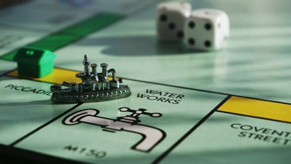 A monopoly board with the boat piece on water works