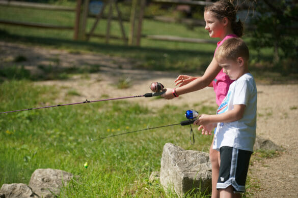 A boy and girl fishing
