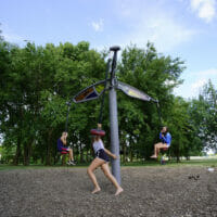 Kids playing on a spinning swing