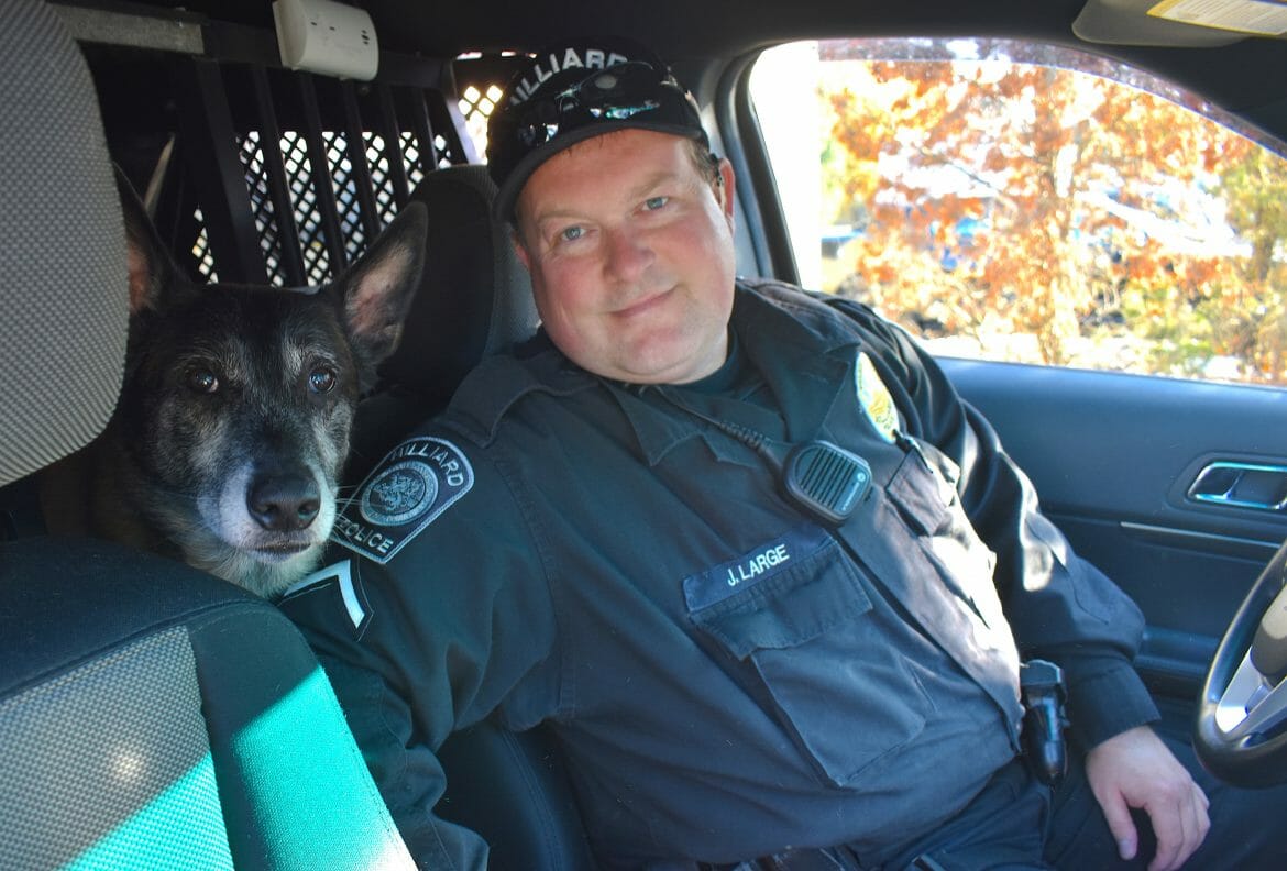 Officer Large and K9 Oz in vehicle