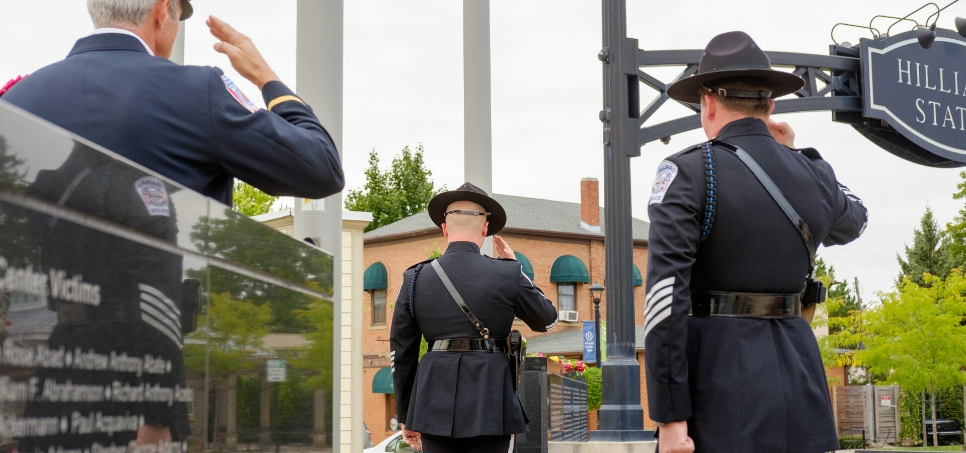 Officers saluting flag