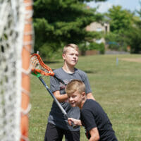 Two boys lacrosse