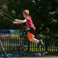 A boy swinging