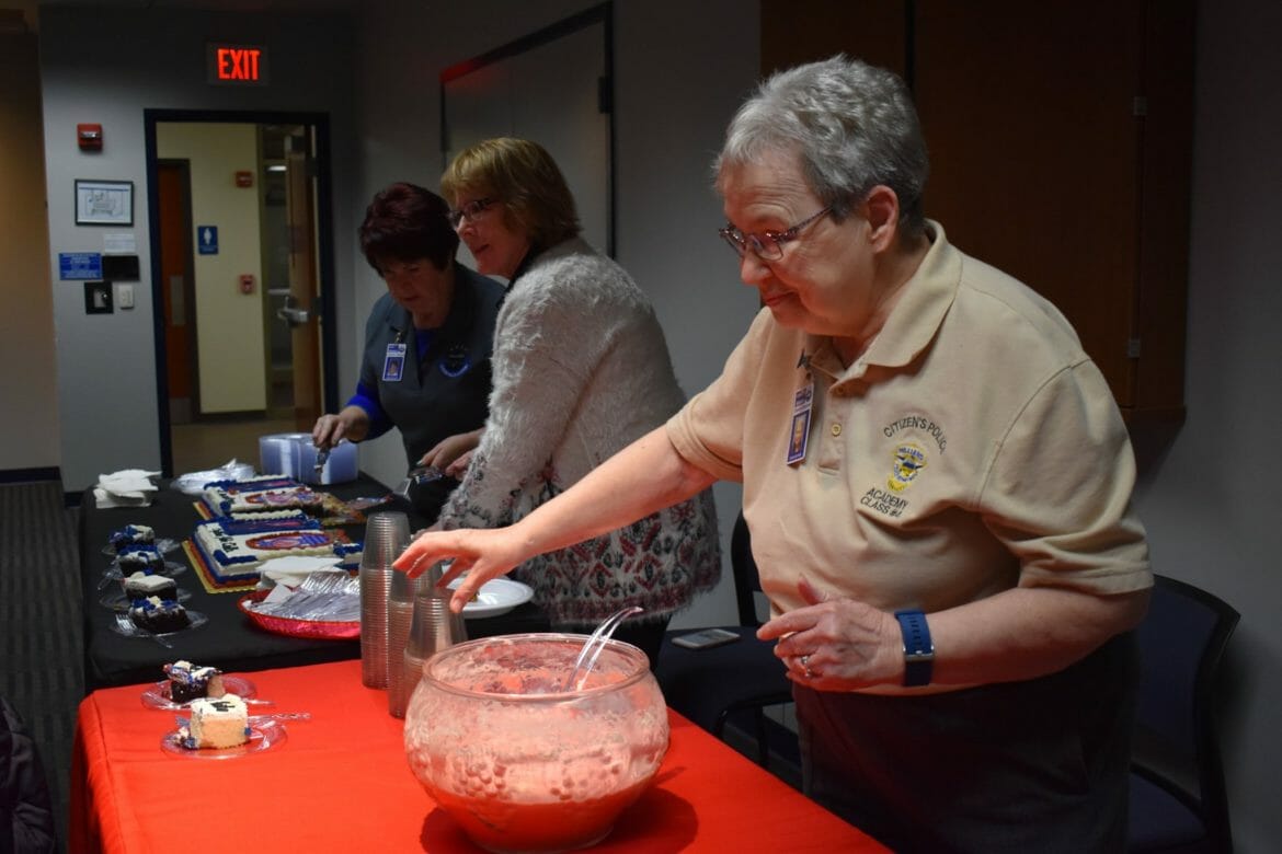 CPA volunteers serving punch at an event
