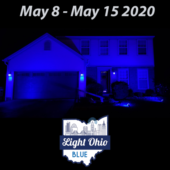 A house at night lit up with a blue light