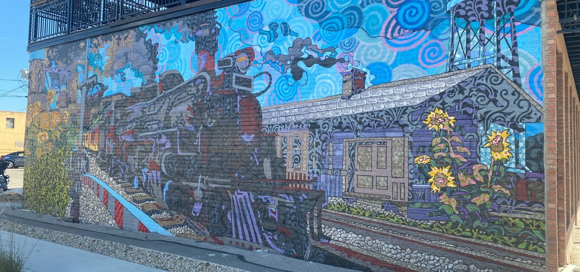 Train mural on the side of Ottie's Tavern