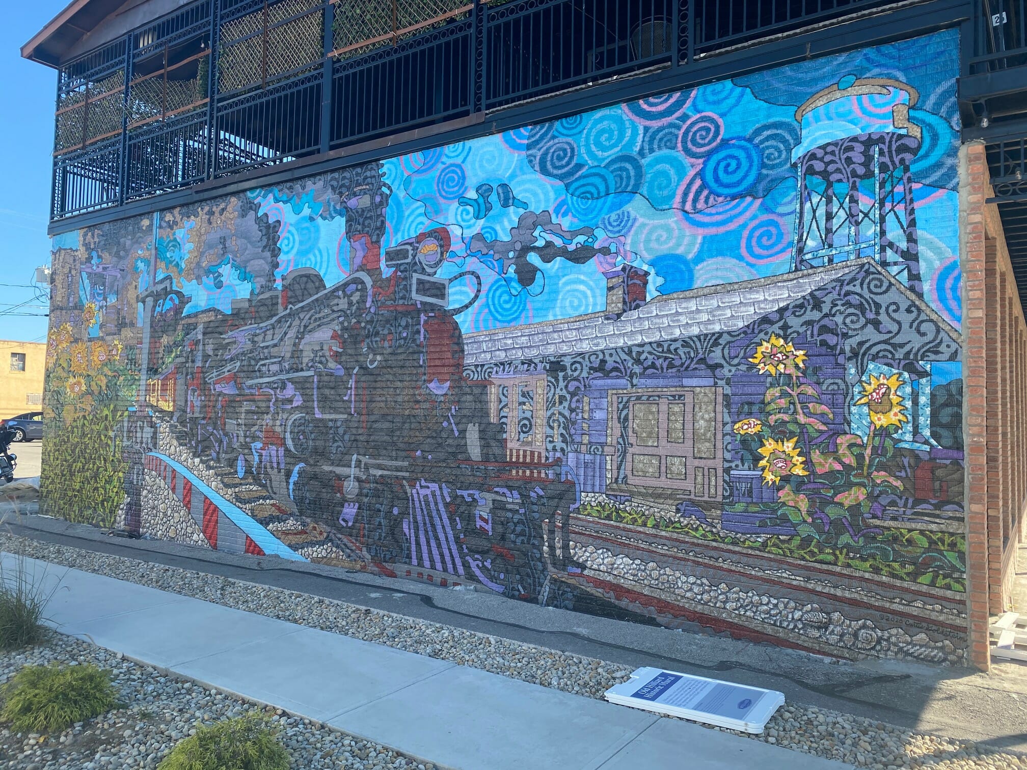 Train mural on the side of Ottie's Tavern