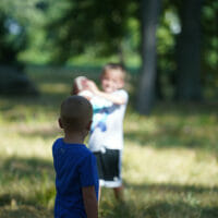 Two boys throwing a football