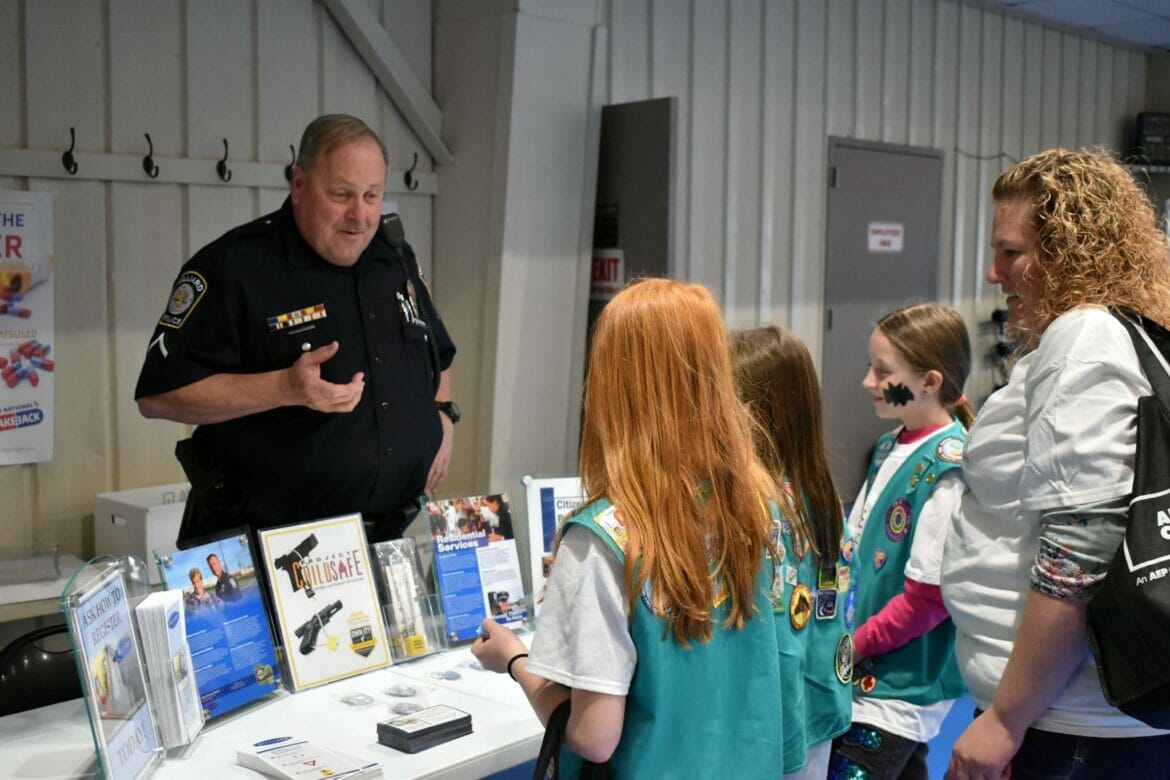 Officer Deaton talking to a group of girl scouts