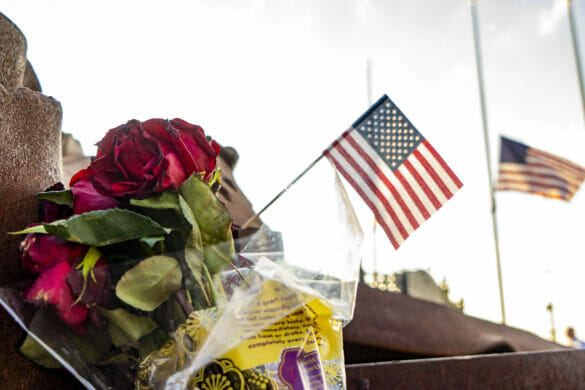 flowers at First Responder's Park with small American flags