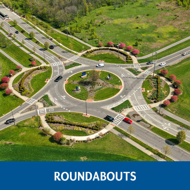 Roundabout with cars going through it