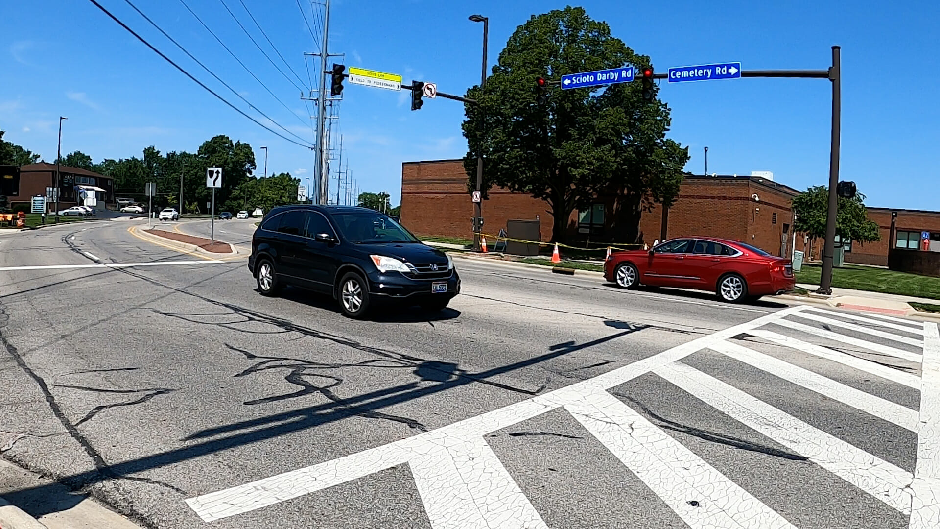Cars driving through traffic signals
