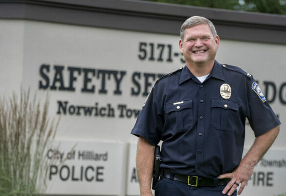Chief Grile in front of safety services sign