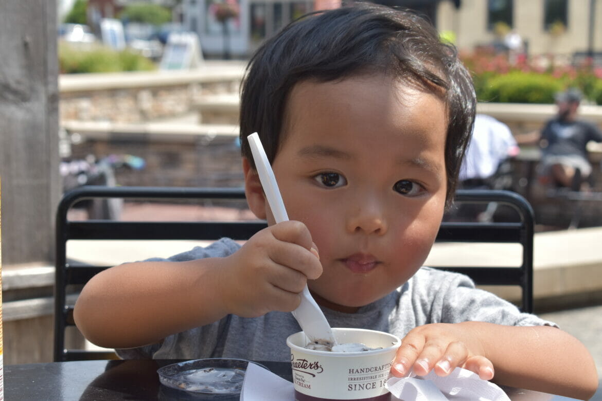 a little boy eating ice cream