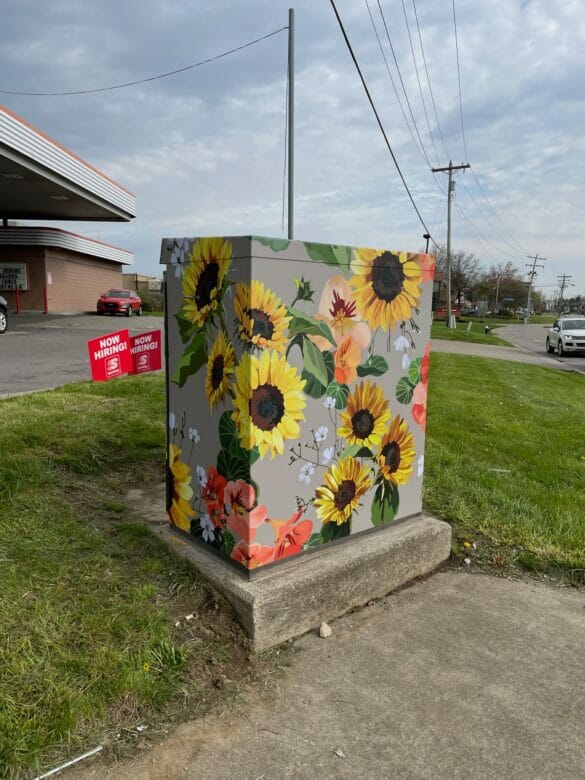 Utility box painted with sunflowers