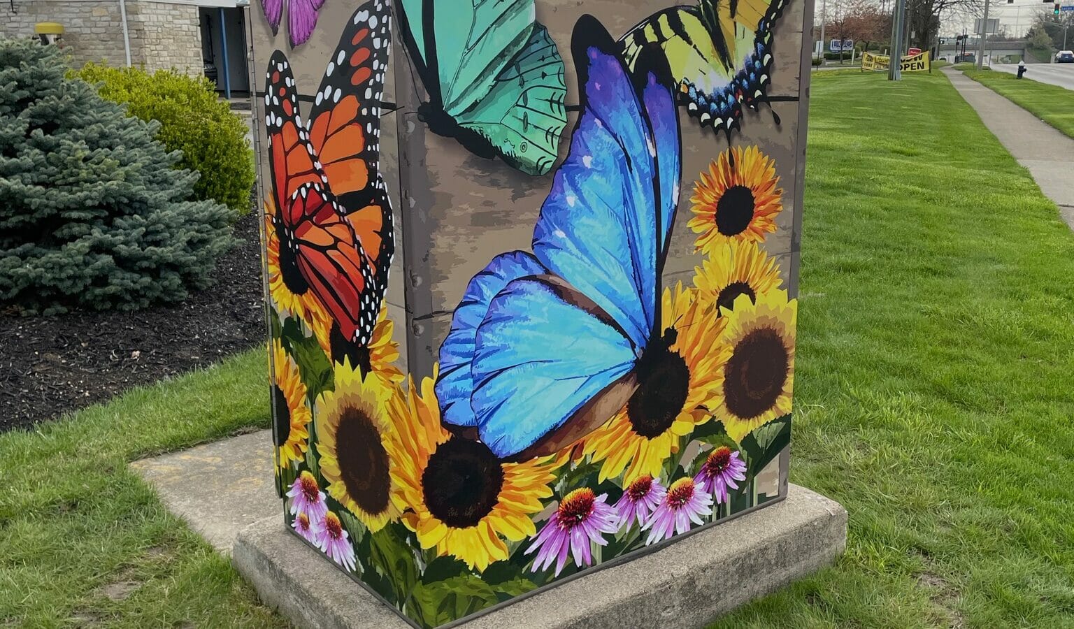 Utility box painted with sunflowers