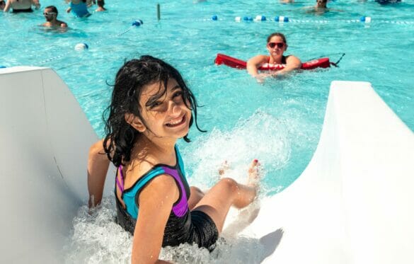 Girl sliding down water slide