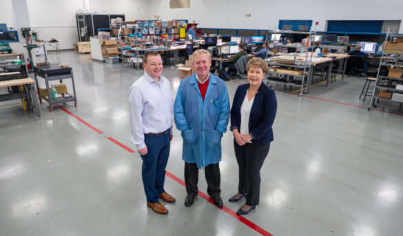 City of Hilliard Economic Development Director David Meadows, Converge Technologies Co-Founder John Bair, and City Manager Michelle Crandall stand inside the lab at Converge Technologies.