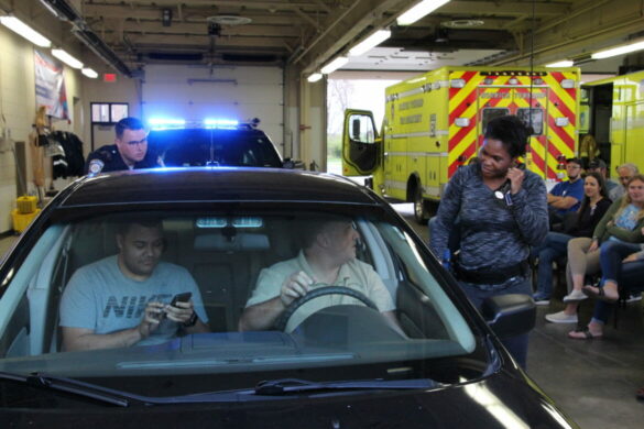 A student in the Hilliard police Citizen's Police Academy learns how police officers perform a traffic stop.