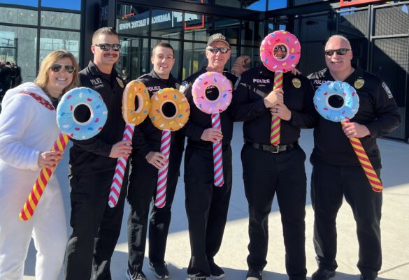 Hilliard police officers pose with donut-shaped rafts during the 2023 Polar Plunge for Special Olympics.