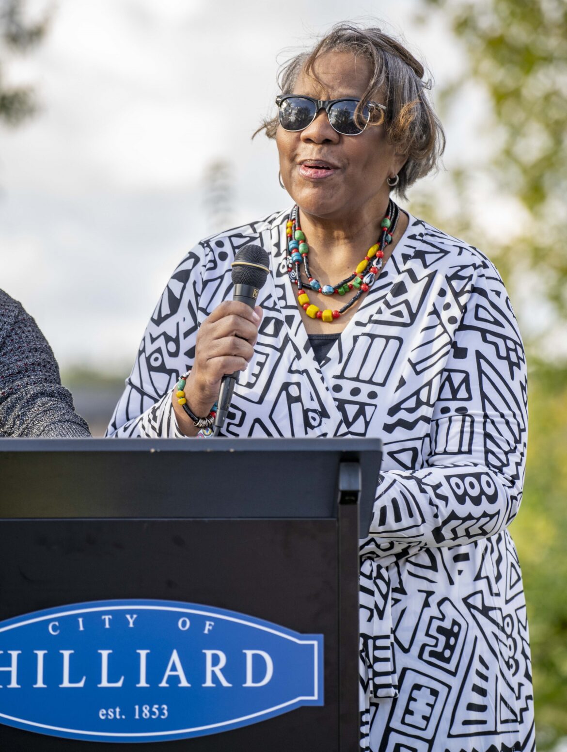 Evonne Merchant Grant speaks to crowd at the Merchant Park dedication ceremony in Downtown Hilliard in October 2021. 