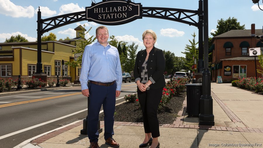 David Meadows and Michelle Crandall stand downtown under the arch