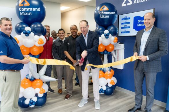 Martin Willoughby, CEO of Command Alkon, cuts the ribbon during a ceremony marking the opening of the company’s new headquarters in Hilliard.