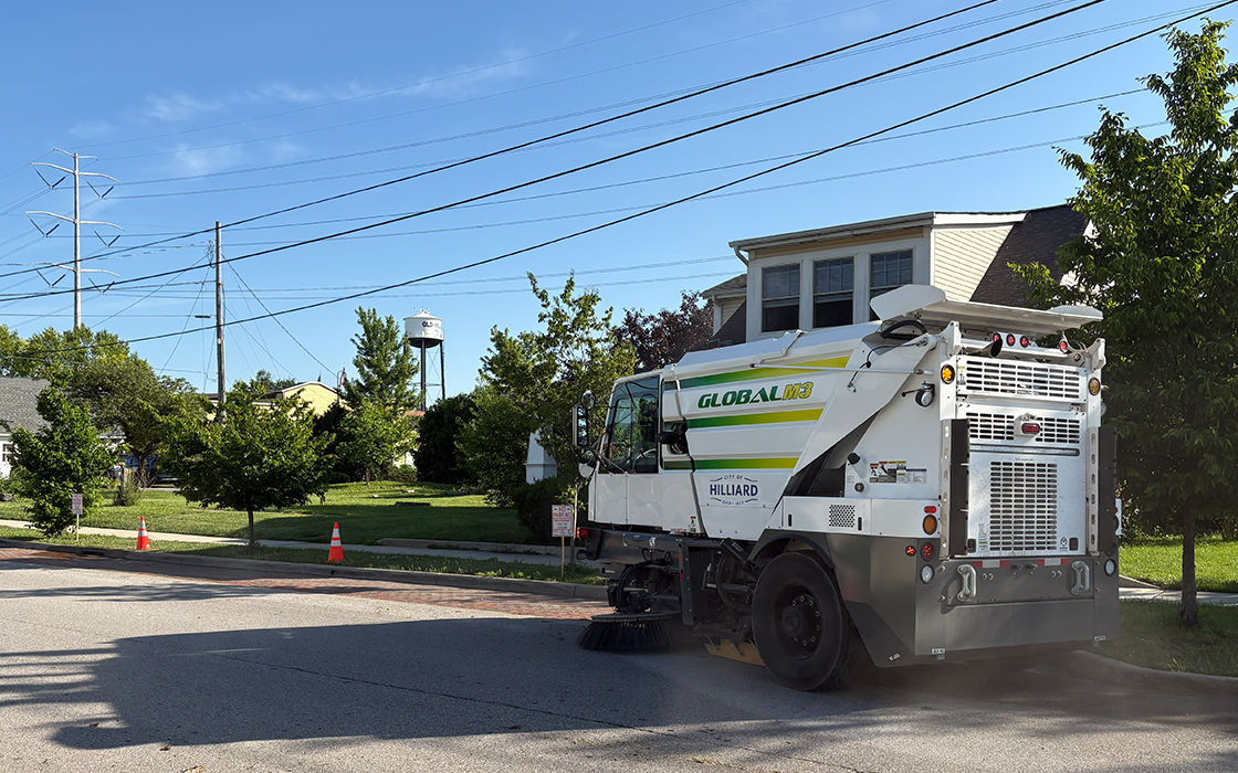 A Hilliard street sweeper sweeps a street in downtown Hilliard.