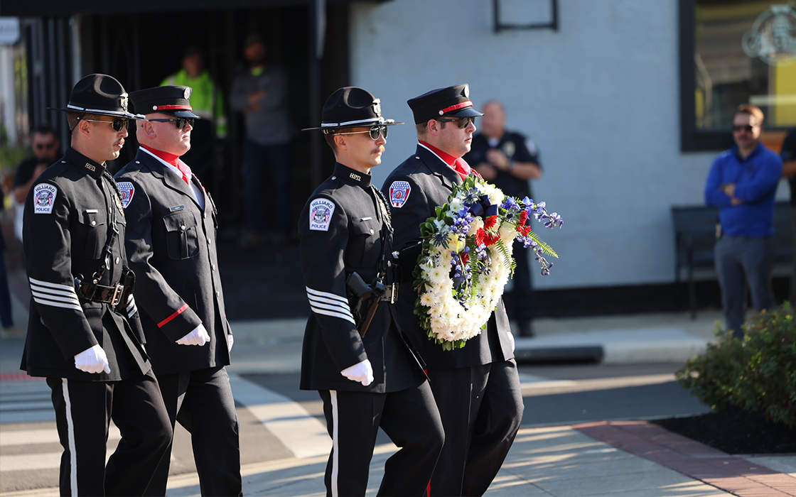 The Hilliard Police and Norwich Fire Department Honor Guard lay a wreath in remembrance of those list in the attacks on 9/11.