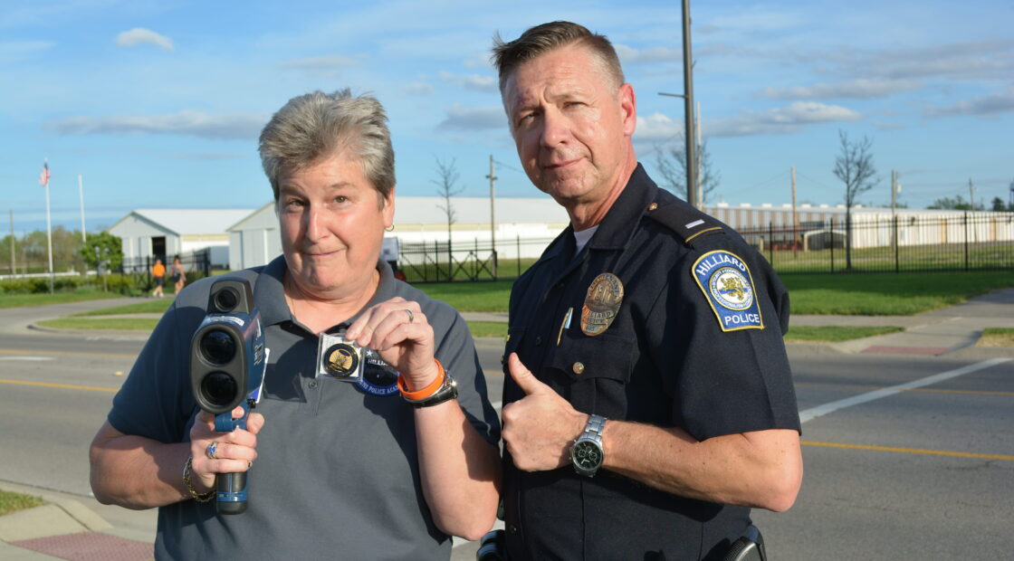 Woman posing with officer